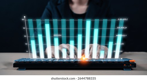 A person types on a keyboard with a digital overlay of rising bar graphs, symbolizing data analysis or financial growth.