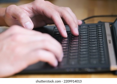 Person Typing On Laptop Closeup