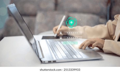 A person is typing on a laptop with a green screen. The laptop is open to a website that requires a password. The person is using a stylus to type the password - Powered by Shutterstock