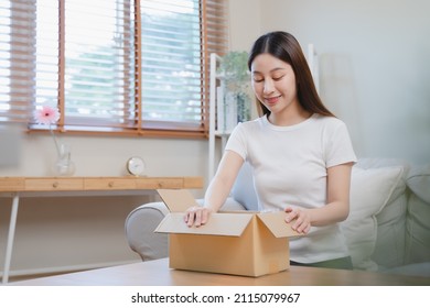 Person Unboxing Package Shopping Online Via Internet At Home