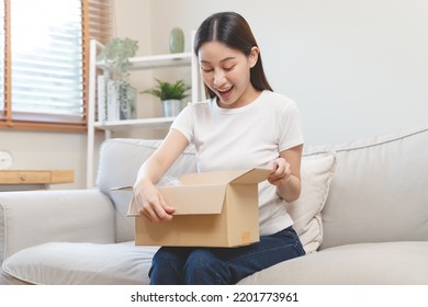 Person Unboxing Package Shopping Online Via Internet At Home