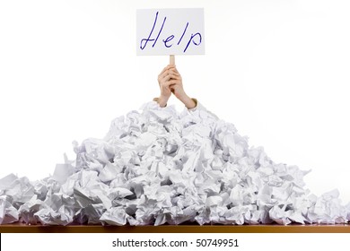 Person under crumpled pile of papers with hand holding a help sign isolated against a white background. - Powered by Shutterstock