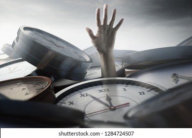 Person under time pressure is stuck between clocks