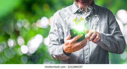 Person Are Use Smart Phone To Save Energy,and Reduce Global Warming,sustainable Business Investments,carbon Credit,reducing Greenhouse Gas Emissions,ESG For Environment Social And Governance