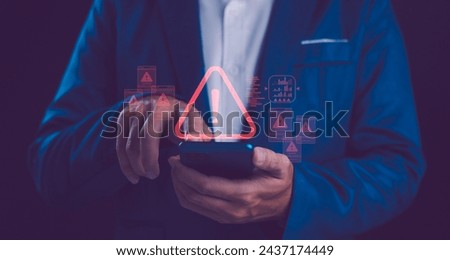 A person uses a smartphone, with a warning triangle and various caution symbols, indicating cybersecurity threats or the management of digital crises. Notification error and maintenance concept. 