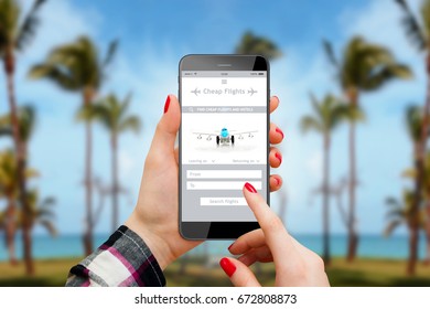 Person Using Cheap Flights App On Phone, Palm Trees And Beach In Background