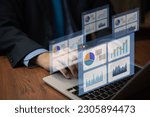 person using computer big data analysis dashboard on virtual screen. Business graph and chart report financial and information marketing plan strategy success concept.