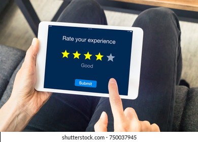 Person Using Digital Tablet Computer At Home To Send Customer Rating With Online Website, Satisfaction Review Based On Star Icons, Concept About Quality Management