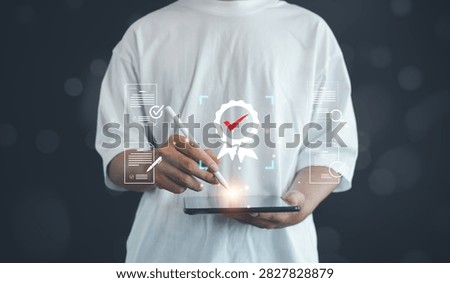 Person using digital tablet to manage document verification, quality assurance, compliance review and certification approval, representing audit processes, standards management and business excellence