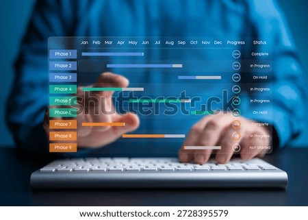 Person using a keyboard to update a virtual glass effect Gantt chart showing project phases and progress. Focus on operational efficiency, scheduling, and professional project management technology.