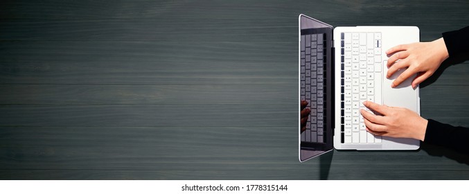 Person using a laptop computer from above