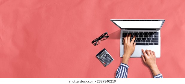 Person using a laptop computer from above