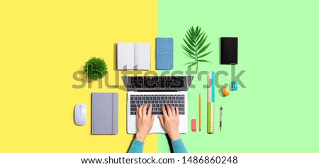 Person using a laptop computer from above