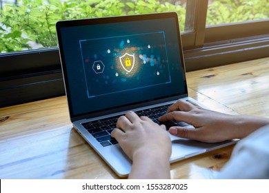 Person using a Laptop Computer with data protection, Cyber security, information safety and encryption concept. internet technology and business concept, Laptop mockup with clipping path on screen.