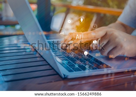 Person using a laptop computer with digital transformation change management, internet of things for new technology and business process strategy, cloud computing for bigdata, Ai technology.