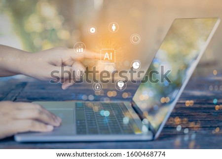 Person using a laptop computer with digital transformation change management, internet of things for new technology and business process strategy, cloud computing for bigdata, Ai technology.