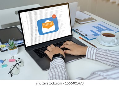 Person Using A Laptop Computer With Email Communication Connection Message Online And Chat On Social Media With Global Letters Concept. Laptop Mockup With Clipping Path On Screen.