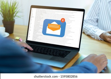 Person Using A Laptop Computer With Email Communication Connection Message Online And Chat On Social Media With Global Letters Concept. Laptop Mockup With Clipping Path On Screen.