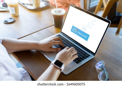 Person Using A Laptop Computer With Email Communication Connection Message Online And Chat On Social Media With Global Letters Concept. Laptop Mockup With Clipping Path On Screen.