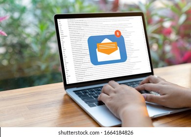 Person Using A Laptop Computer With Email Communication Connection Message Online And Chat On Social Media With Global Letters Concept. Laptop Mockup With Clipping Path On Screen.