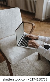 Person using laptop computer. Freelancer home office desk workspace. Online shop, store, blog concept.