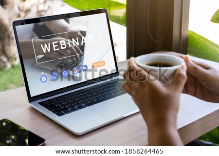 Person using a laptop computer for online training webinars. E-learning browsing connection and cloud online technology webcast concept. Laptop mockup with clipping path on screen.