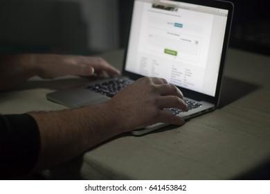 Person Using Laptop In Dark Room. Moody, Sinister.