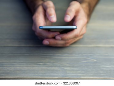 Person using mobile phone over white background - Shutterstock ID 321838007