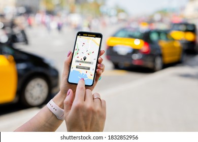 Person Using Ride Sharing App On Mobile Phone