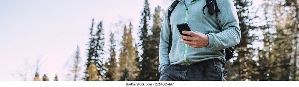 person using smart phone in the forest - Powered by Shutterstock