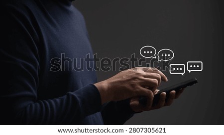 Person using smartphone with chat message icons, online communication, social media messaging, digital conversation, mobile texting, customer support, chatbot interaction, modern communication concept