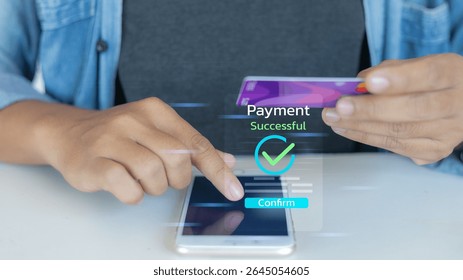 A person using a smartphone to confirm an online payment with a credit card. Fintech concept of secure digital transaction and successful payment confirmation.