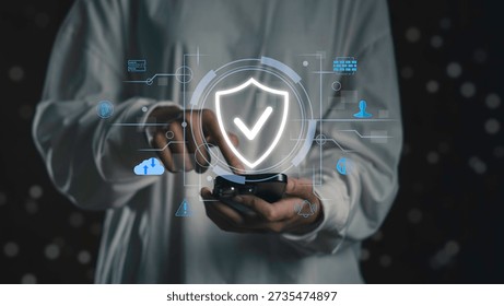 Person using smartphone with digital security interface and shield icon, Mobile data protection, secure communication, encryption technology, and privacy-focused smartphone security systems.