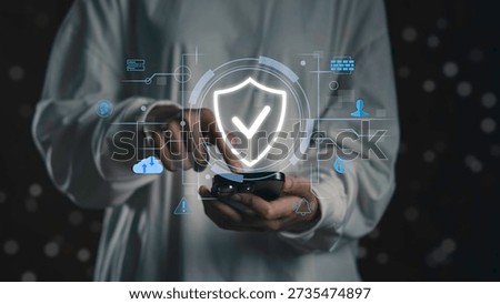 Person using smartphone with digital security interface and shield icon, Mobile data protection, secure communication, encryption technology, and privacy-focused smartphone security systems.
