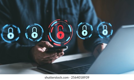 Person using smartphone and laptop with digital locks, blue and red glowing symbols, symbolizing cybersecurity and data protection