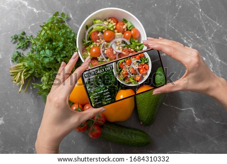 Person using smartphone to track nutrition facts and calories in her food