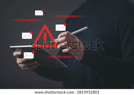 Person using tablet with cybersecurity warning alerts representing data breach, phishing attack, email scam, malware detection, online security risks, cyber threat, and information protection concepts