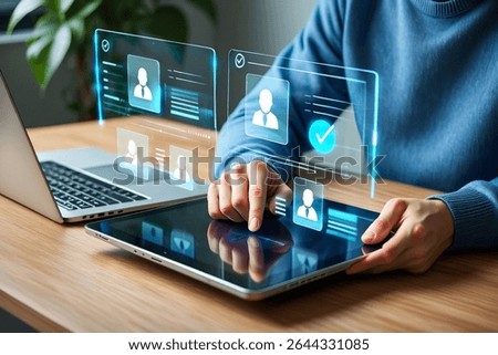 Person using tablet with digital interface showing profile verification and user management.