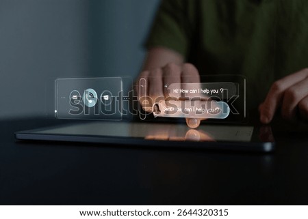 Person using tablet with holographic interface displaying chatbot conversation and contact options.