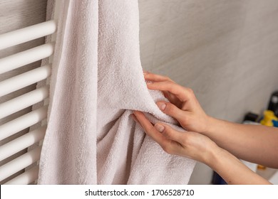 Person Using Towel For Wiping Hands Dry After Washing In Bathroom At Home. Hygiene And Hand Care. Keeping Your Hands Clean During A Covid-19 Coronavirus Pandemic