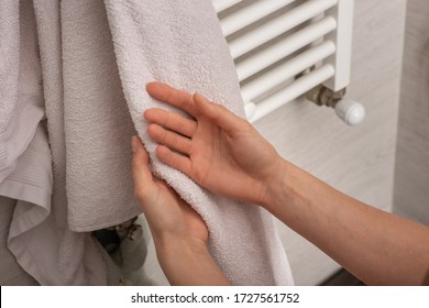 Person Using Towel For Wiping Hands Dry After Washing In Bathroom At Home. Hygiene And Hand Care. Keeping Your Hands Clean During A Covid-19 Coronavirus Pandemic