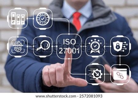 Person using virtual touch screen push text: ISO 27001. ISO 27001 Standard certification standardisation quality control concept. ISO 27001 certified for information security management system (ISMS).