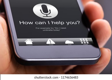 Person Using Voice Recognition Function On Mobile Phone