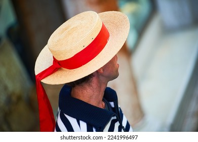 Person with Venetian gondolier hat and red bow, Venice, Italy