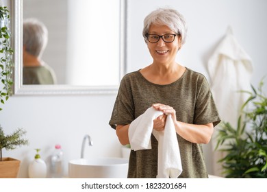 Person is washing hands and using towel. Protection against coronavirus. Prevention, hygiene to stop spreading virus. - Shutterstock ID 1823201684