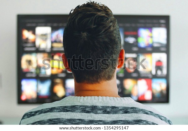 Person watching\
TV shows on a streaming\
service.