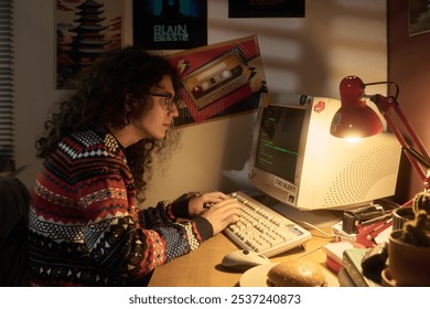 Person wearing colorful sweater typing on vintage computer in cozy, dimly lit room decorated with various retro posters on wall. Facing warm lamp light, someone immersed in nostalgic setup - Powered by Shutterstock