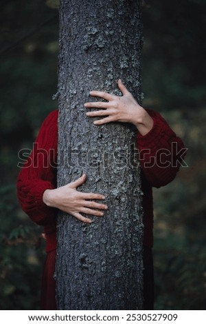 Similar – hands of woman hugging a tree