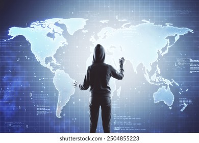 Person wearing a hoodie stands in front of a digital world map on a virtual screen. Dark room. Concept of cyber security and global hacking - Powered by Shutterstock