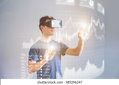 Person wearing virtual reality (VR) headset or head-mounted display (HMD) glasses to interact with financial dashboard with stock market key performance indicators (KPI) and business intelligence (BI) - Powered by Shutterstock